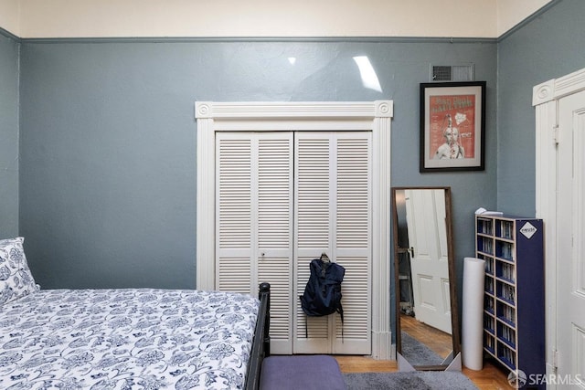 bedroom featuring visible vents and a closet