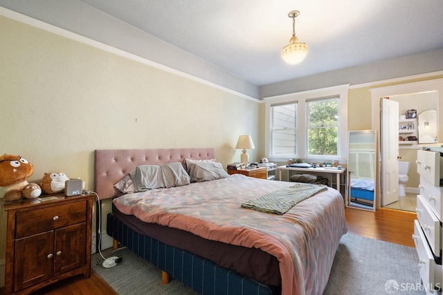 bedroom featuring wood finished floors