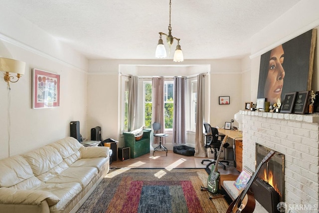 living room with a fireplace and a textured ceiling