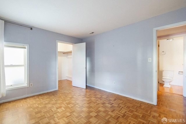 empty room with visible vents and baseboards