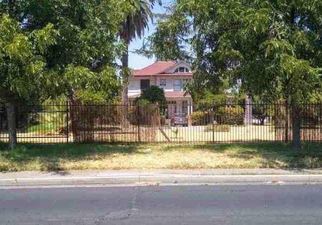 view of property hidden behind natural elements