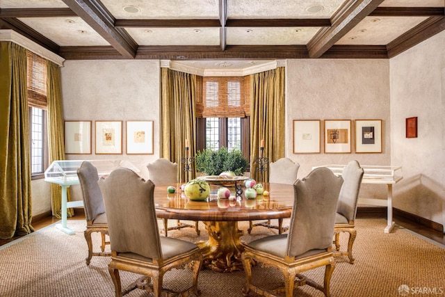 dining area with beamed ceiling, ornamental molding, a healthy amount of sunlight, and coffered ceiling