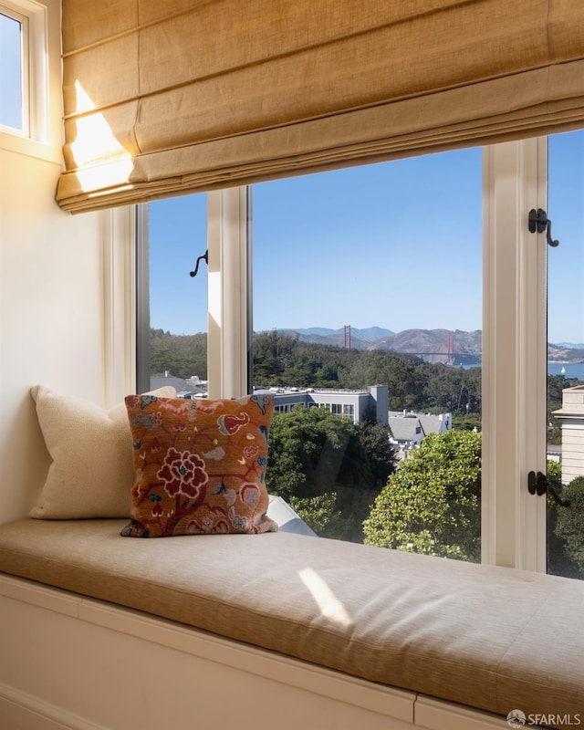 sitting room featuring a wealth of natural light and a mountain view