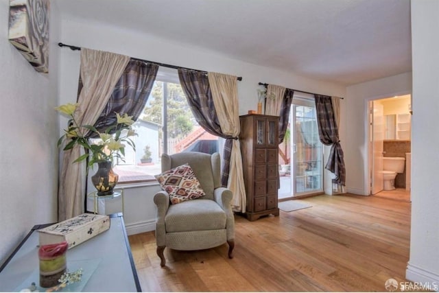 sitting room with light hardwood / wood-style flooring