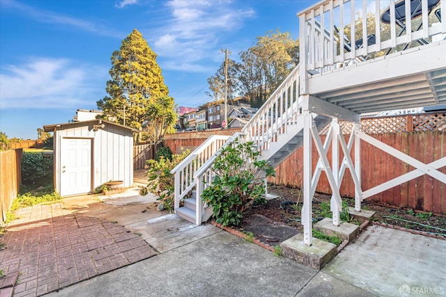 view of patio featuring a shed