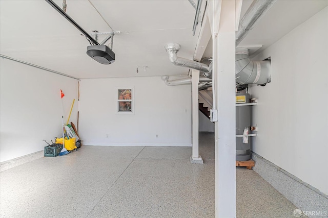 garage featuring water heater and a garage door opener