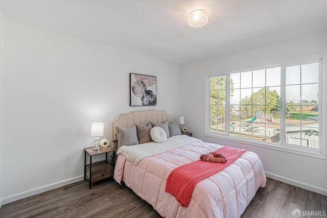 bedroom featuring dark hardwood / wood-style flooring