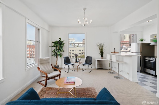 carpeted living room with radiator and an inviting chandelier