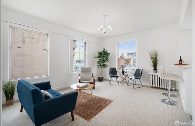 living area featuring light carpet, radiator, and a chandelier