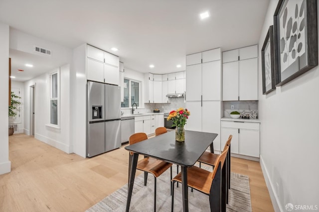 31 Romolo Pl Unit 1, San Francisco, CA 94133 - dining space with light wood-style flooring, recessed lighting, and baseboards