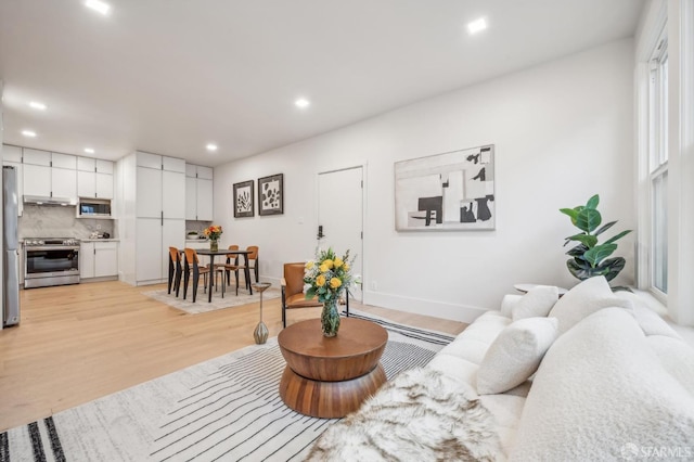 31 Romolo Pl Unit 1, San Francisco, CA 94133 - living area featuring light wood finished floors, recessed lighting, and baseboards