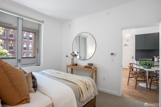 bedroom featuring wood-type flooring