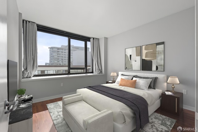 bedroom featuring dark wood-type flooring