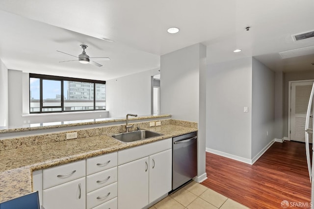 kitchen featuring dishwasher, white cabinets, sink, ceiling fan, and light hardwood / wood-style floors