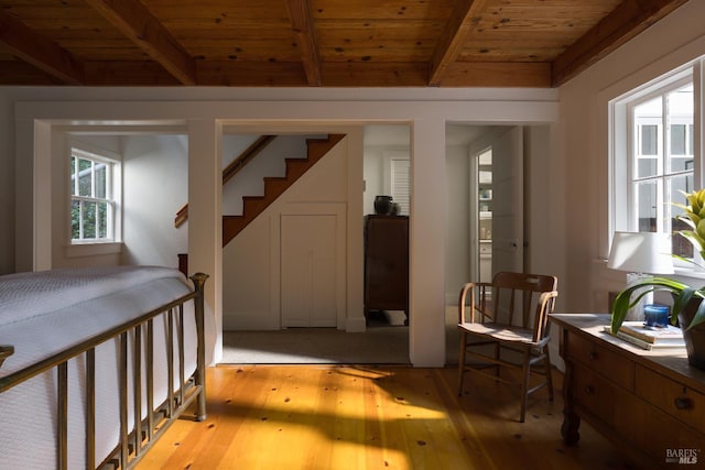 2770 Bohemian Hwy, Occidental, CA 95465 - sitting room with light wood-style flooring, a wooden ceiling with exposed beams, and stairs