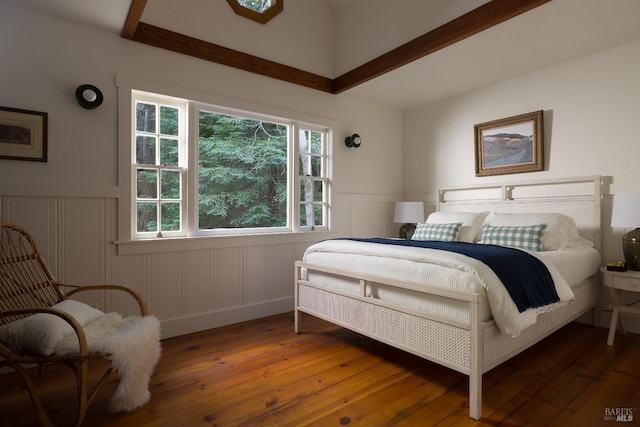 2770 Bohemian Hwy, Occidental, CA 95465 - bedroom with a wainscoted wall, hardwood / wood-style floors, and a decorative wall