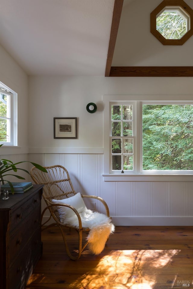2770 Bohemian Hwy, Occidental, CA 95465 - sitting room featuring wainscoting, wood finished floors, beam ceiling, and a decorative wall