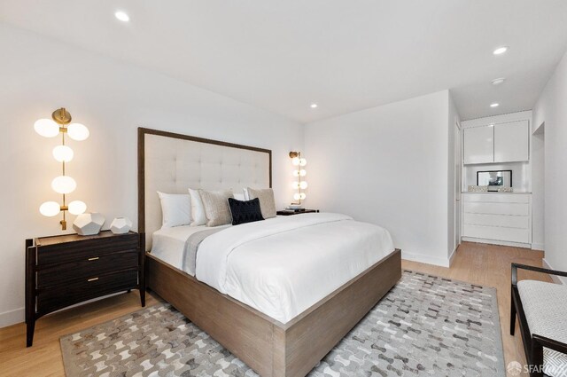 bedroom featuring light hardwood / wood-style flooring