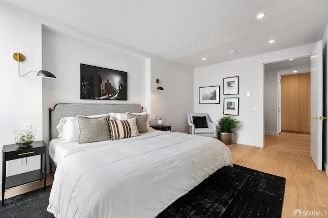 bedroom with wood-type flooring