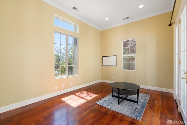 sitting room with dark hardwood / wood-style flooring and ornamental molding