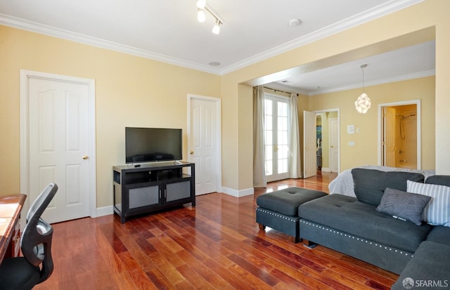 living room featuring dark hardwood / wood-style flooring and ornamental molding