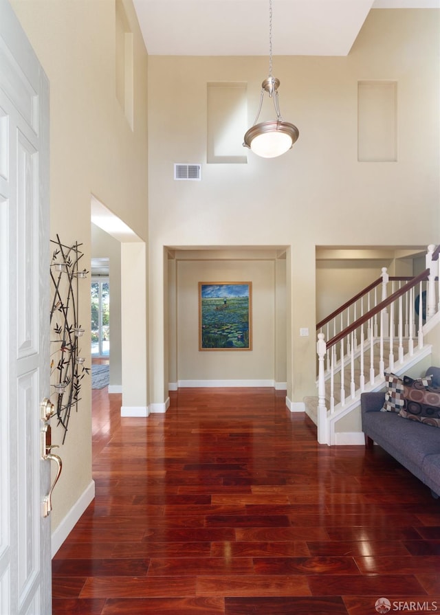 foyer with dark hardwood / wood-style floors