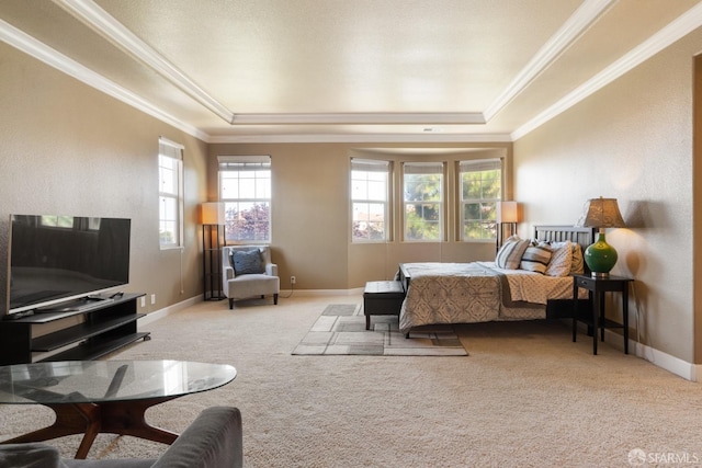 bedroom featuring a tray ceiling, light colored carpet, and ornamental molding