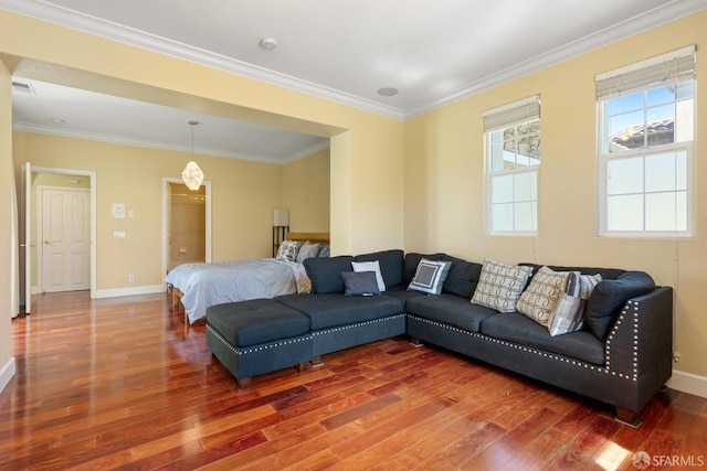 living room featuring dark hardwood / wood-style floors and ornamental molding