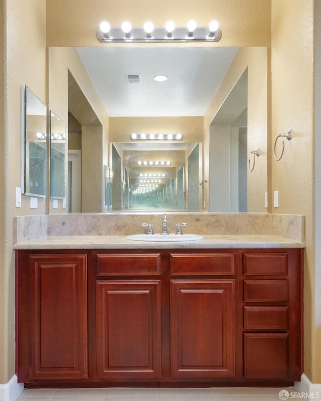 bathroom featuring tile patterned floors and vanity