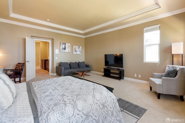 bedroom featuring light colored carpet, ornamental molding, and a tray ceiling