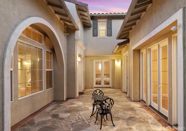 patio terrace at dusk with french doors