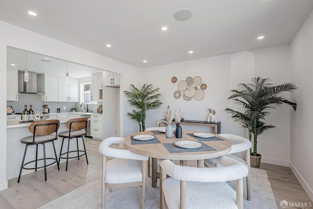 dining area with recessed lighting, baseboards, and light wood-style floors