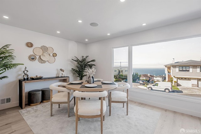 dining area with recessed lighting, visible vents, baseboards, and light wood finished floors