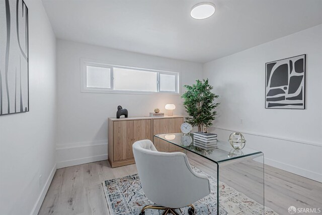 office with light wood finished floors and baseboards