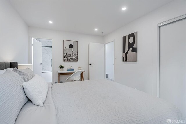 bedroom with recessed lighting and ensuite bathroom