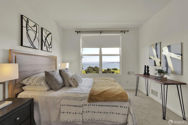 bedroom with visible vents, baseboards, and carpet flooring