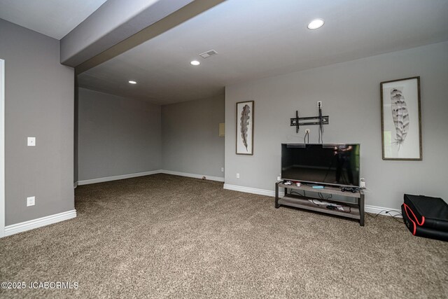 unfurnished living room featuring visible vents, carpet flooring, and baseboards