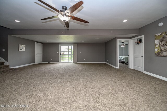 unfurnished living room featuring stairway, ceiling fan, baseboards, and carpet
