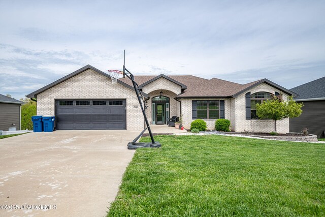 view of front of property featuring a shingled roof, a front lawn, concrete driveway, an attached garage, and brick siding