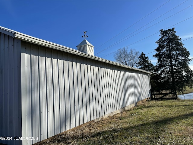 view of property exterior with a lawn