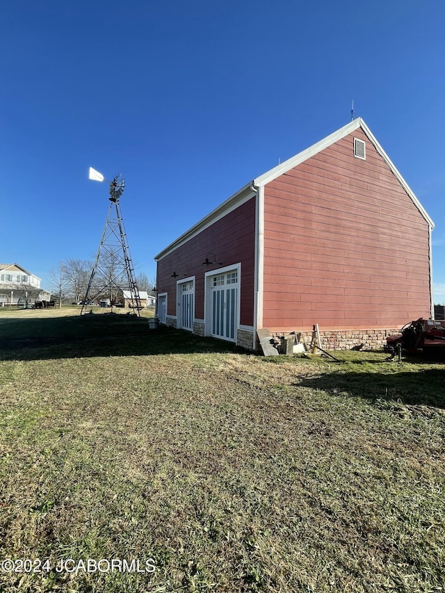 view of home's exterior with a lawn