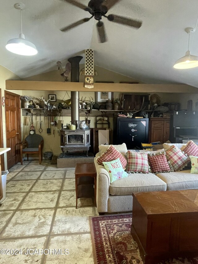 living room featuring ceiling fan and lofted ceiling