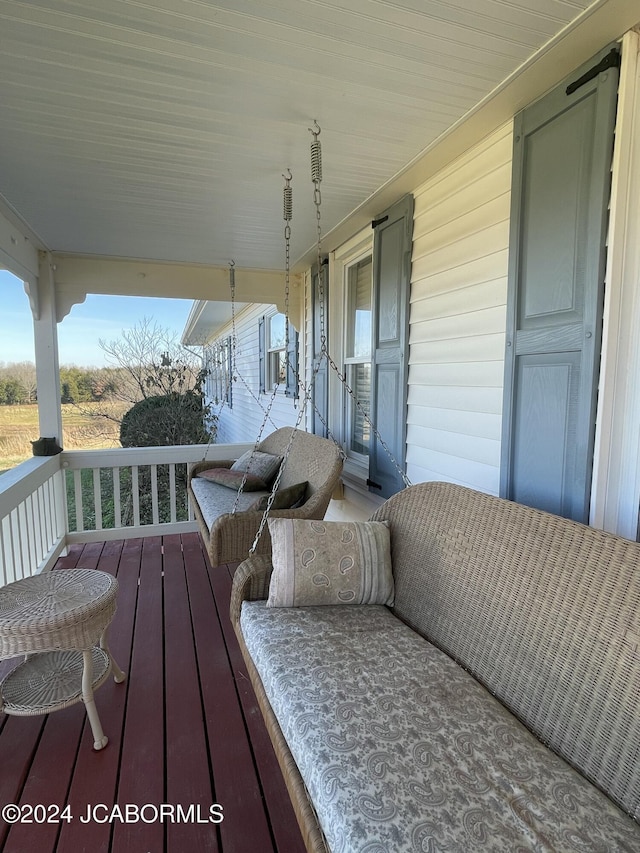 wooden terrace with a porch