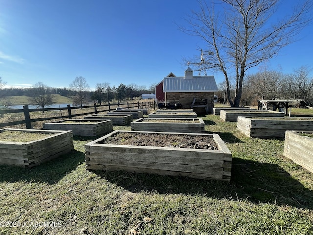 view of yard with a rural view and an outdoor structure