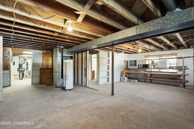 unfinished basement featuring gas water heater