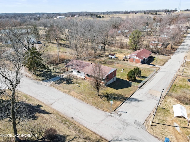 birds eye view of property featuring a rural view