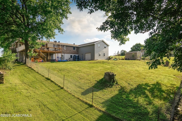 4758 Henwick Ln, Jefferson City, MO 65109 - view of yard featuring a deck, stairway, and an attached garage
