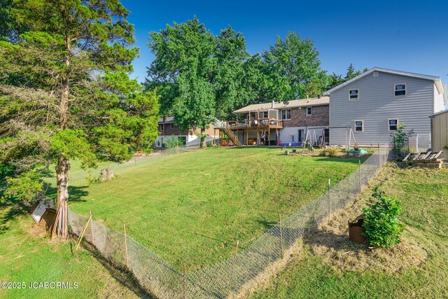 4758 Henwick Ln, Jefferson City, MO 65109 - fenced backyard featuring stairs and a wooden deck