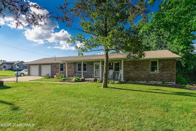 4758 Henwick Ln, Jefferson City, MO 65109 - ranch-style home featuring a garage, driveway, a front yard, and brick siding