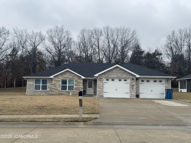 view of front of home featuring a garage and a front yard